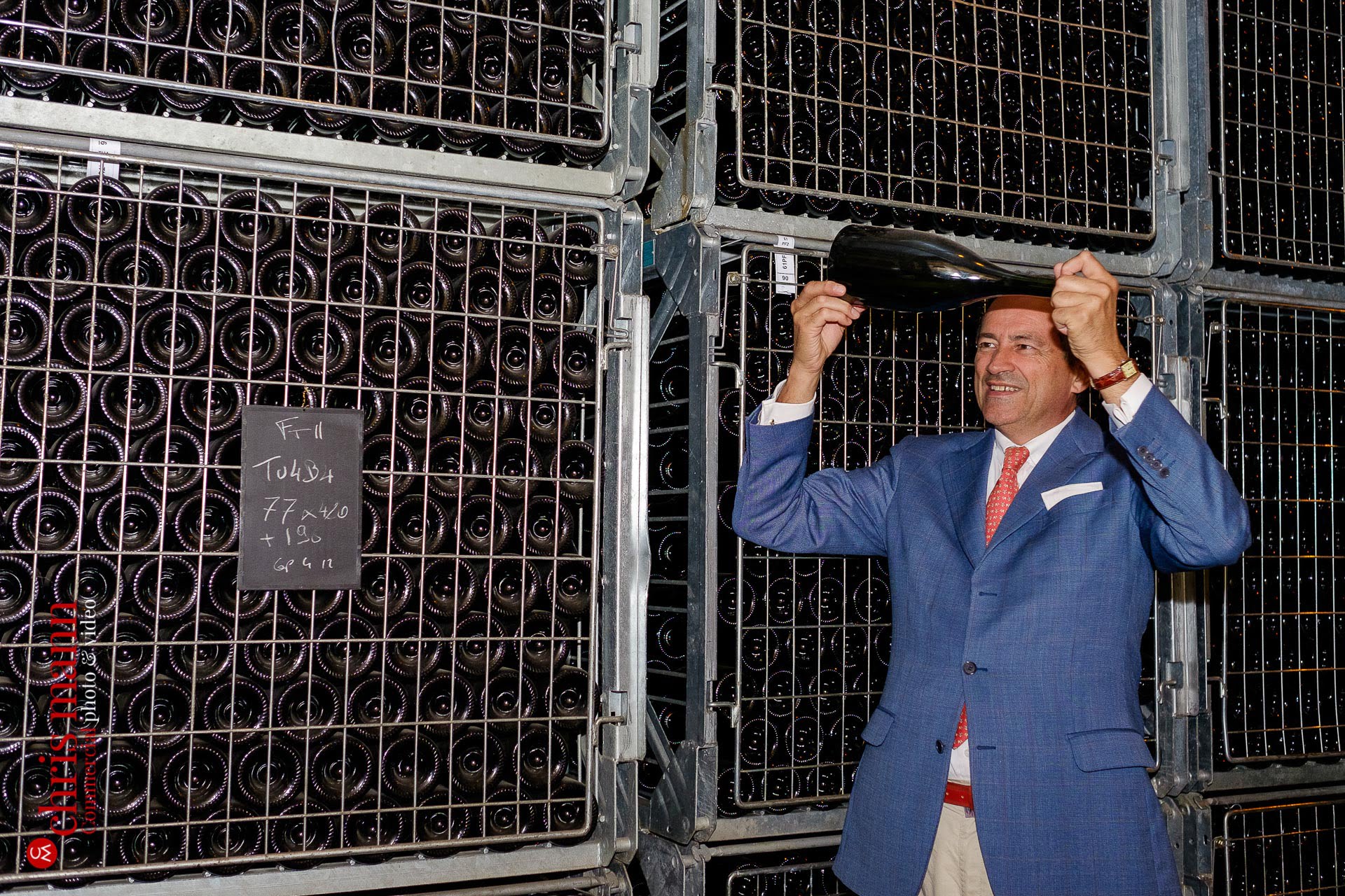Bruno Paillard examines a bottle of his champagne Reims France