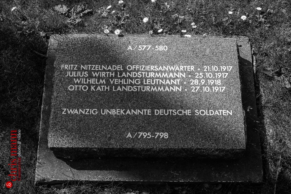 Simple flat rectangular markers commemorate the fallen at Langemark-Poelkapelle German Cemetery, West Flanders, Belgium.