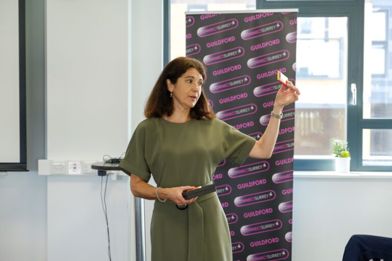 presenter at business networking meeting shows product Connect Surrey Guildford